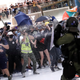 Riot police use pepper spray to disperse people inside a mall in Hong Kong, July 14, 2019.